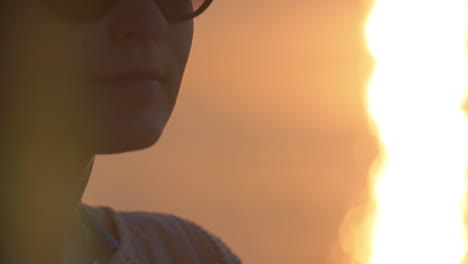 Woman-drinking-water-outdoor-at-sunset