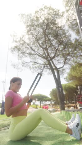 woman performing resistance training in an outdoor gym