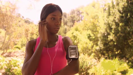 sportswoman is listening music for run