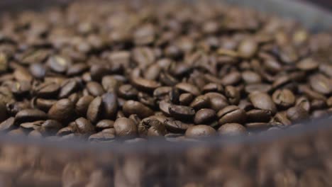 Close-up-moving-backwards-of-roasted-coffee-beans