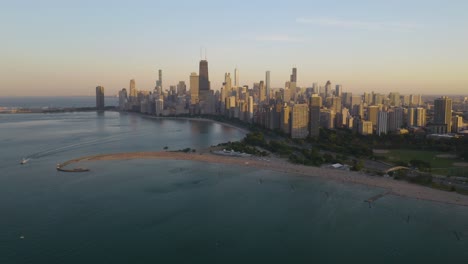 fixed aerial view above lake michigan with chicago skyline in background