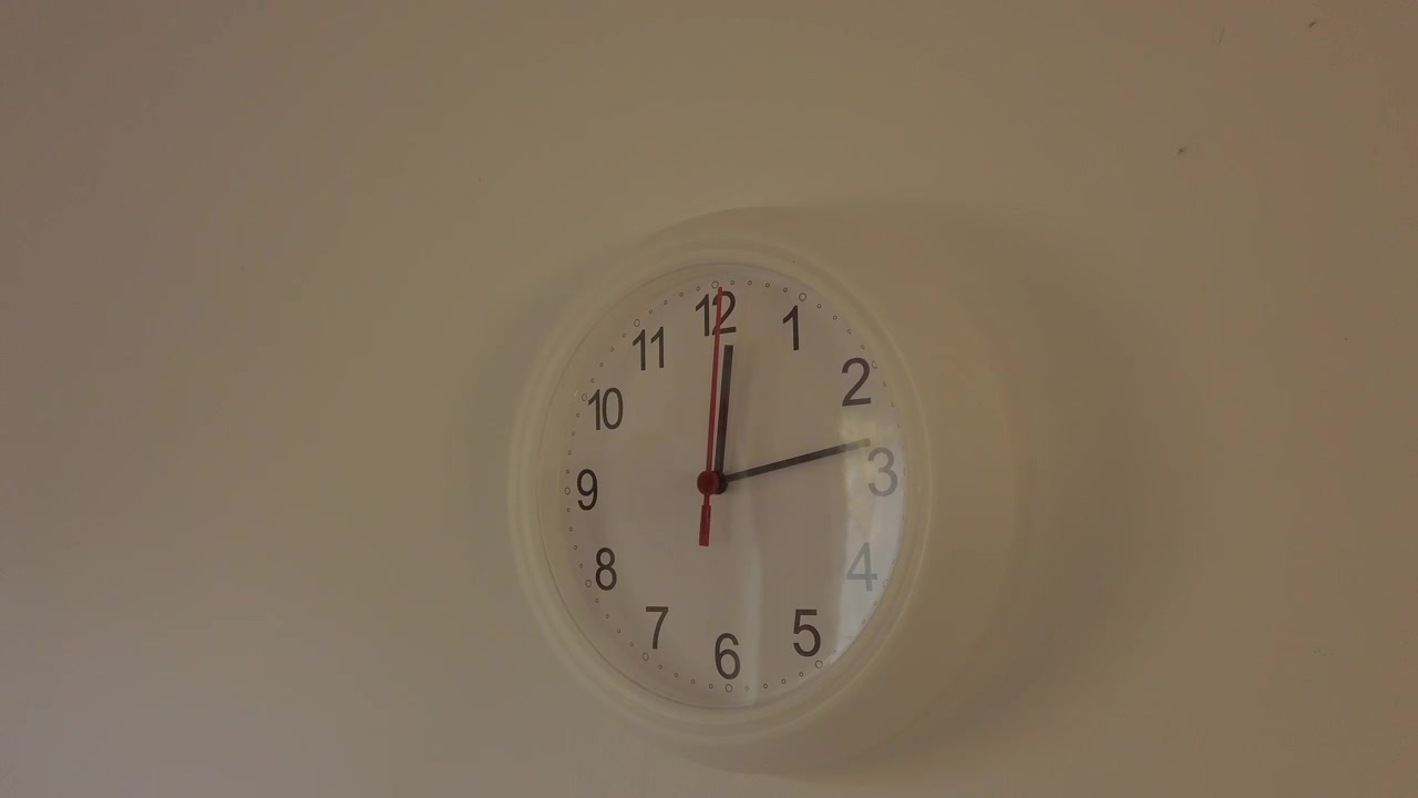 The beginning of time 12.13 am or pm, Clock hands seconds walk slowly, Close up a white wall clock, Time concept.