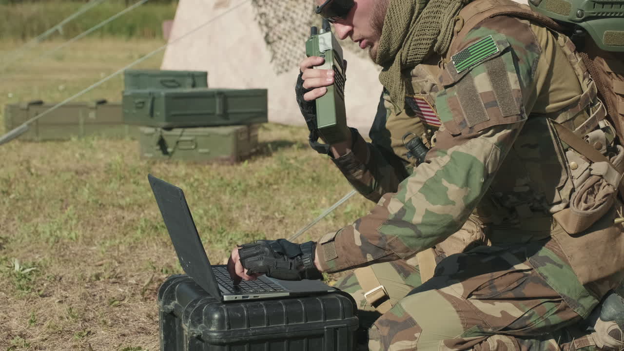 Military Surveillance Officer Using Radio