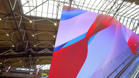 cube-shaped screen at the airport hall