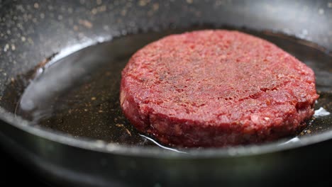 vegan burger cooking in a pan