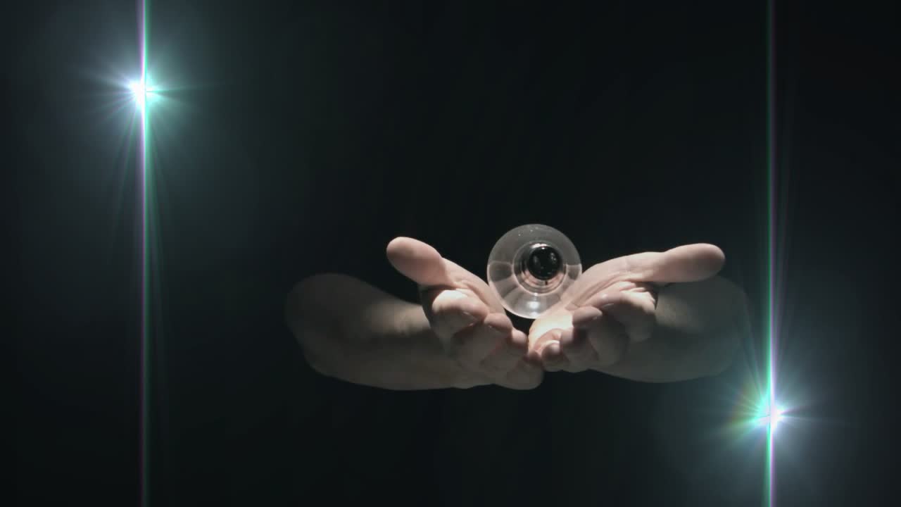 Palms opening releasing bulb, hands guiding bulb rising and falling, showcasing light idea