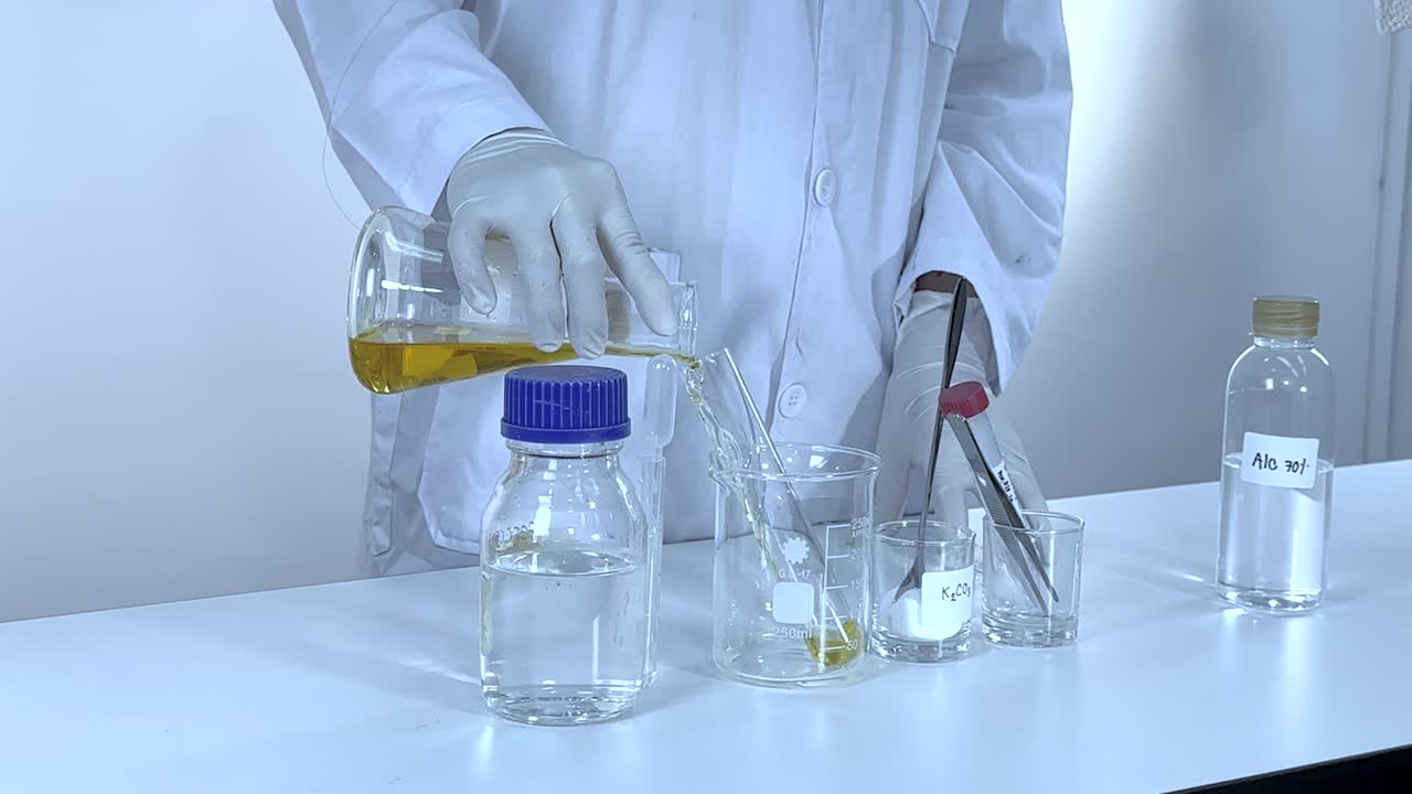 Scientist conducts a vibrant chemical reaction using potassium carbonate in a controlled lab setting with precise measurements
