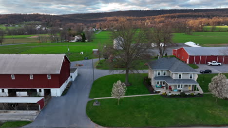 Red-barn-and-family-farmhouse