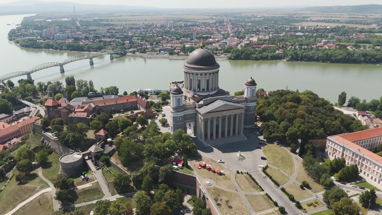 Sweeping aerial orbit of Hungary’s Esztergom Basilica, capturing its grand architecture and panoramic views of the Danube River