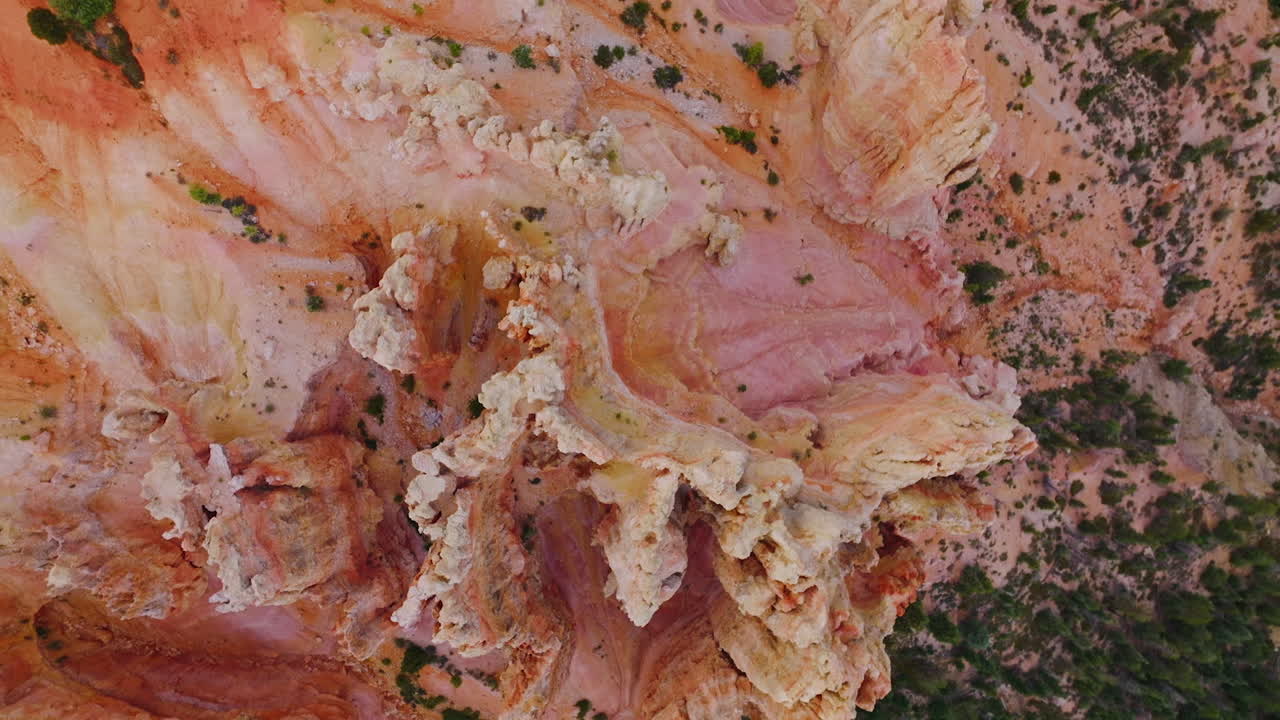 Amazingly shaped rocks of beautiful coral color. Bryce National Park canyons from top view at daytime.