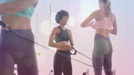 fitness training with resistance bands animation over women exercising in gym