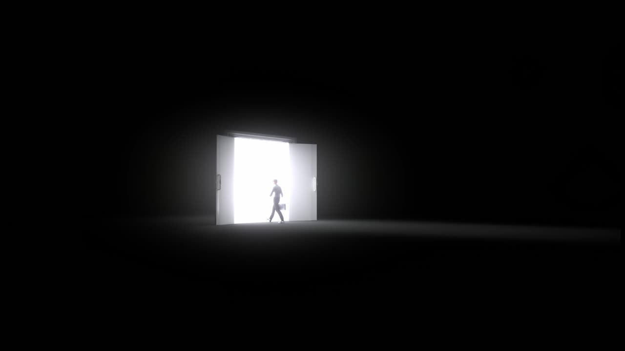 Man Walking Towards Bright Light Door In Dark Room