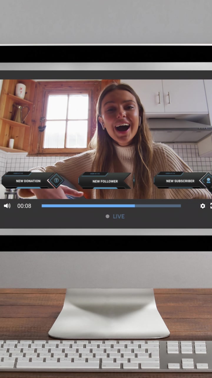 Animation of social media screen on computer over caucasian woman making video blog
