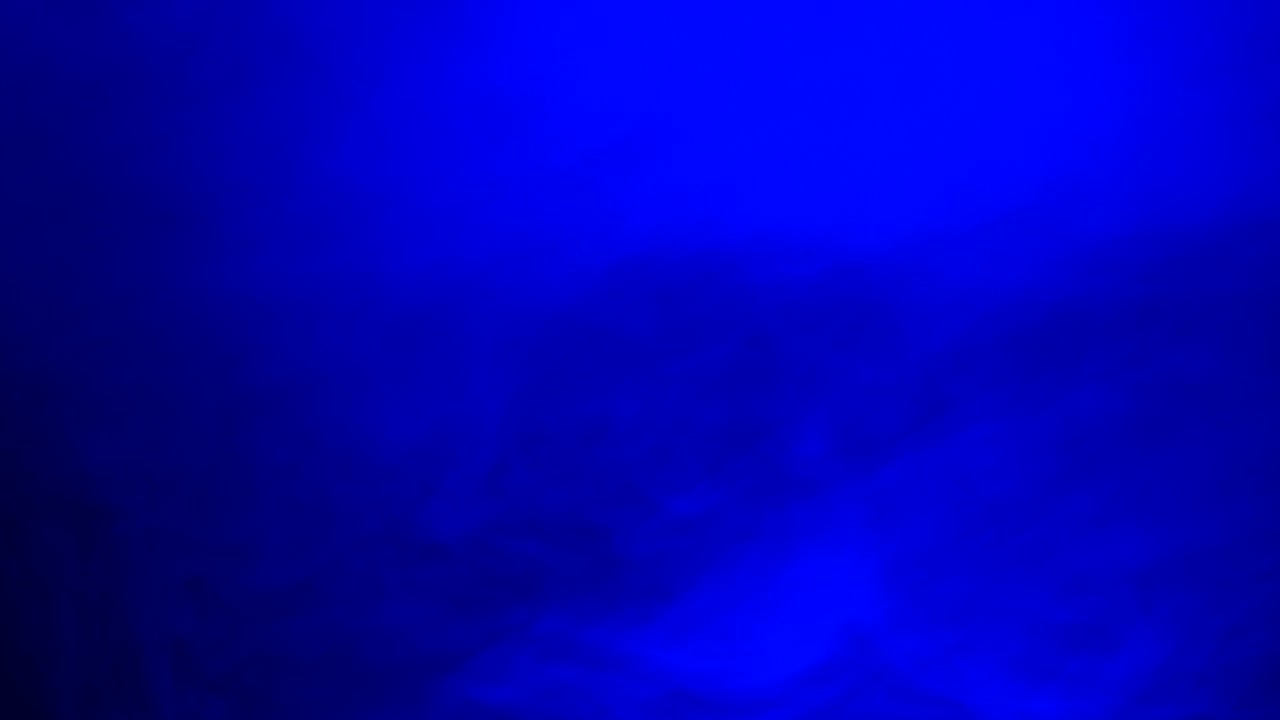 Ambient, abstract, sci fi, ethereal blue smoke and light motion background for mystical, dreamlike, background atmosphere with calm, serene slow motion fog and moving smoke and light.