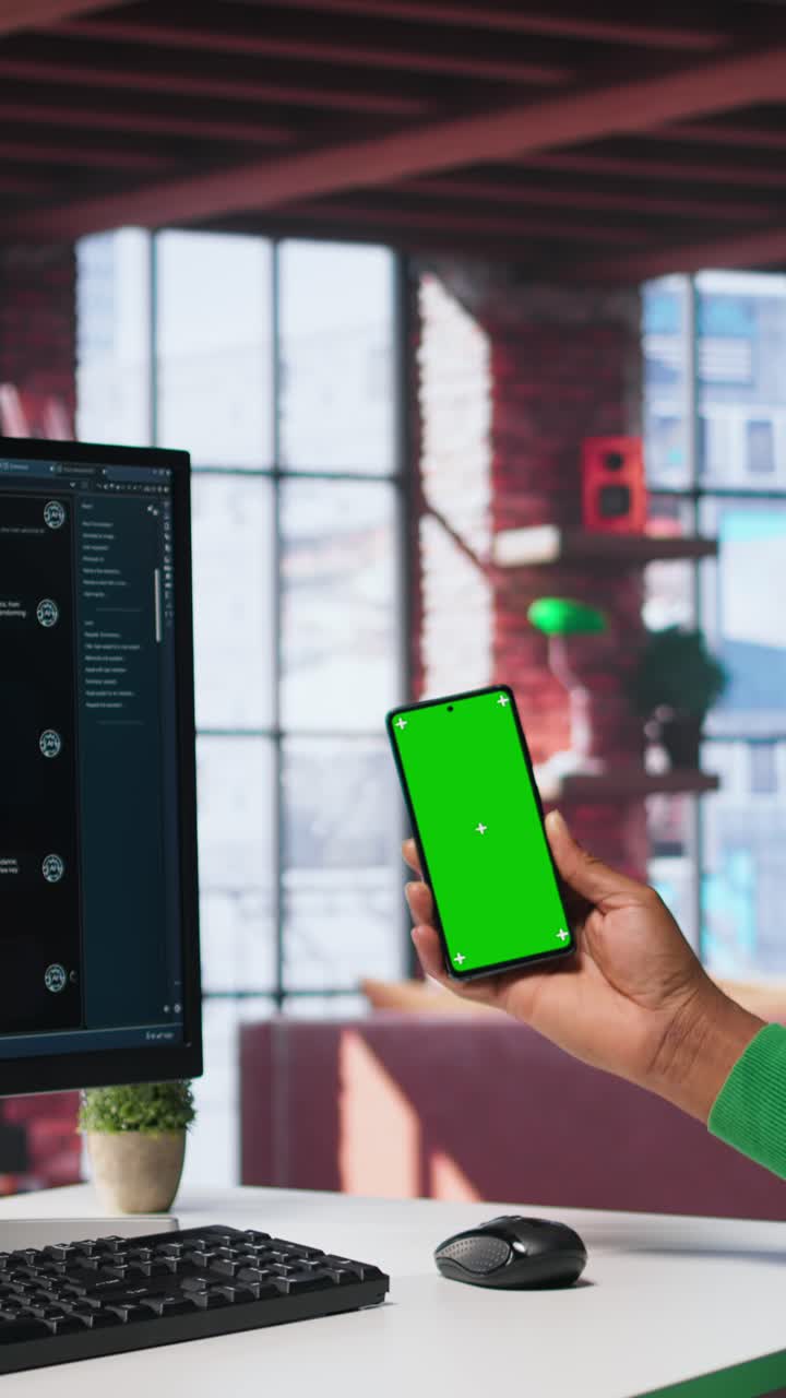 Vertical Video Black male worker in his loft using copy space PC to analyze sales reports
