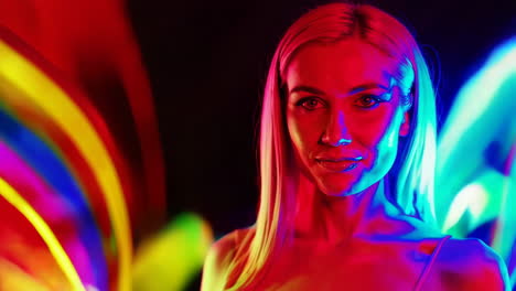 vibrant portrait of a woman with colorful light trails