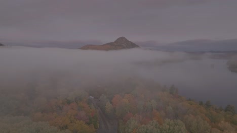 Road-disappears-into-thick-fog-leading-to-Borestone-Mountain-Piscataquis-County,-Maine