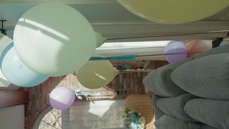 A-Canopy-of-Helium-Balloons-in-Pastel-Hues