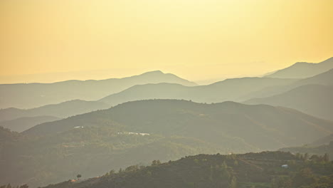 view of a misty orange sky over mount olympus on the island of cyprus