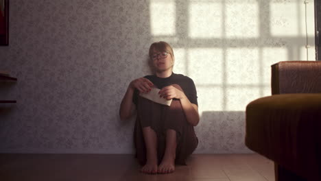 woman sitting alone on the floor