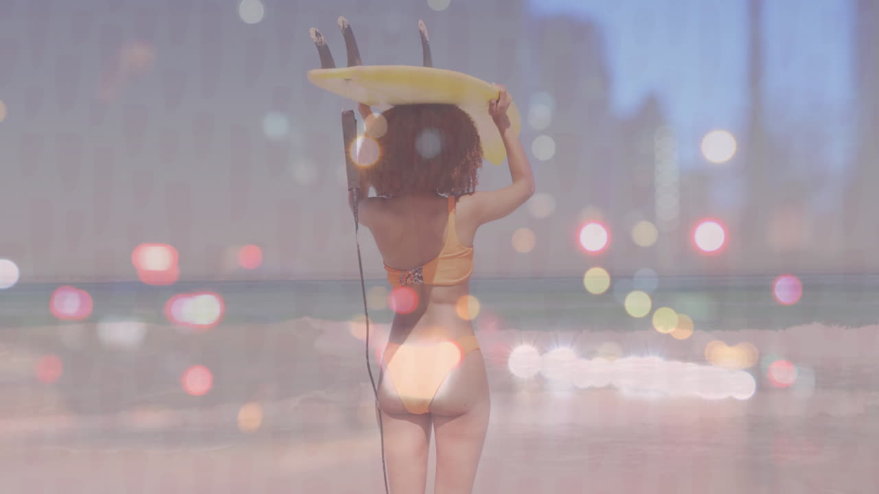 Female surfer lifting surfboard on sandy beach, featuring animated light flares for marketing