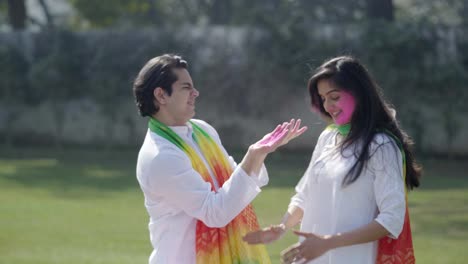 Indian-man-plays-with-his-wife-on-Holi