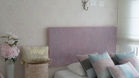 girl's-room-with-bed-and-cushions-and-flowers