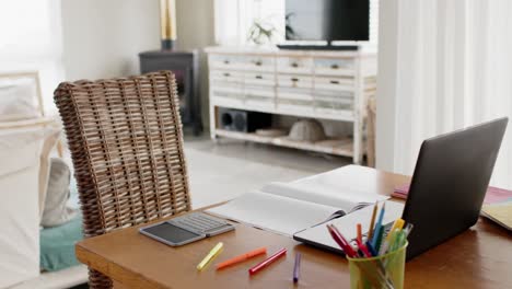 close up of home office table with laptop, calculator and notebook, slow motion