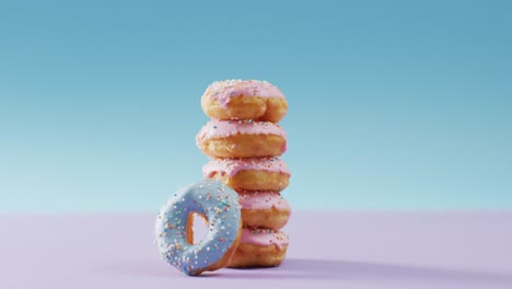 Video-Von-Donuts-Mit-Zuckerguss-Auf-Rosa-Und-Blauem-Hintergrund