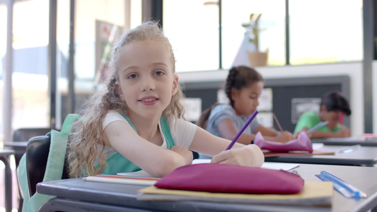 Caucasian girl studying in a school classroom