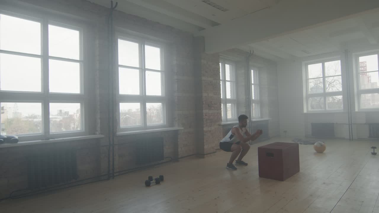 Black Sportsman Doing Box Jumps Indoors