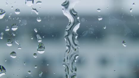 glistening water droplets on transparent surface, capturing intricate patterns and reflections during a rainy day, bringing nature's beauty indoors