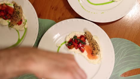 chef drizzling green sauce to add a pop of color and flavor to a dish