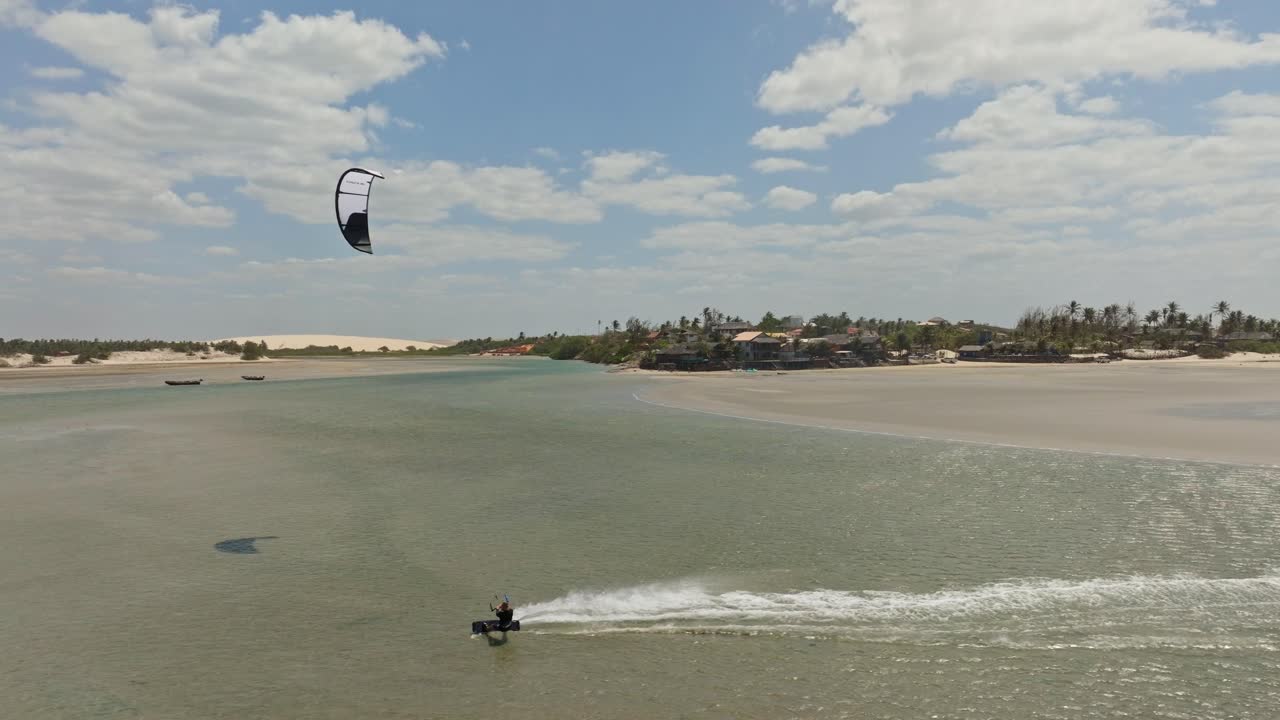 Kitesurfer riding in a shallow lagoon near Jericoacoara
