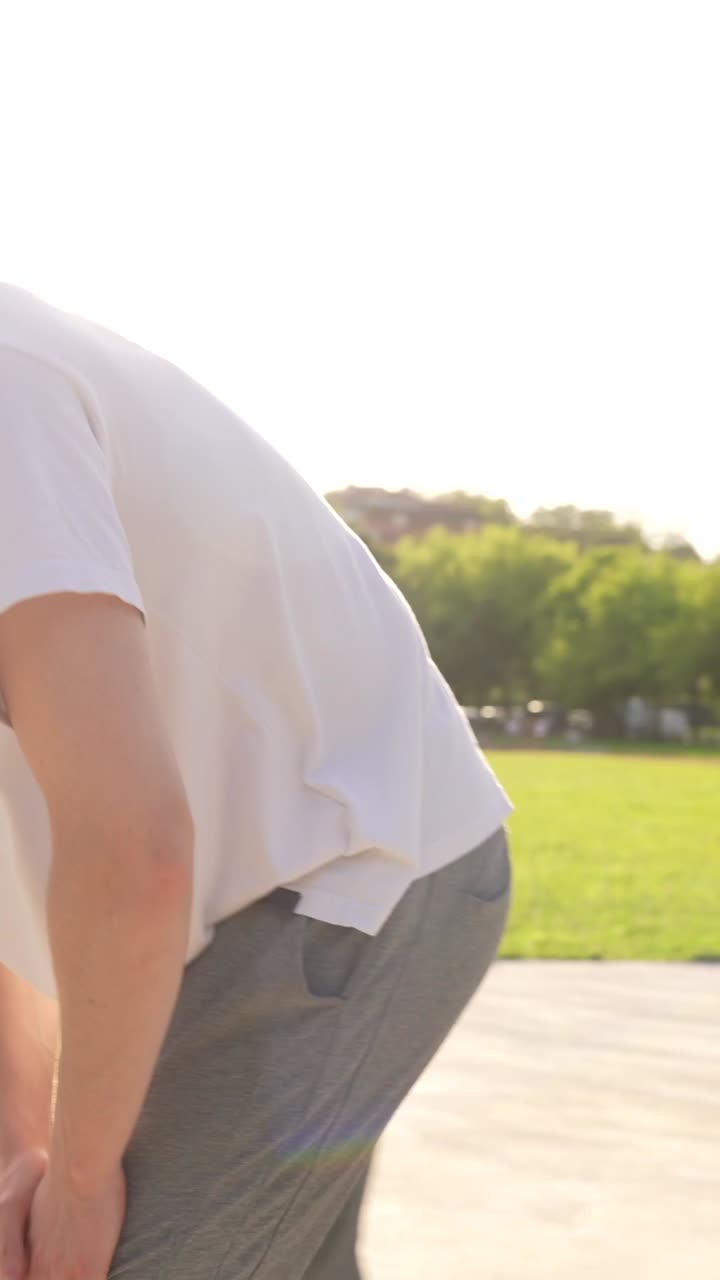 Man outdoors on a track and field