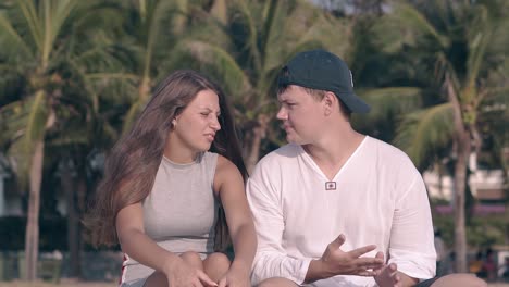 pretty lady with long hair waved by wind talks to guy