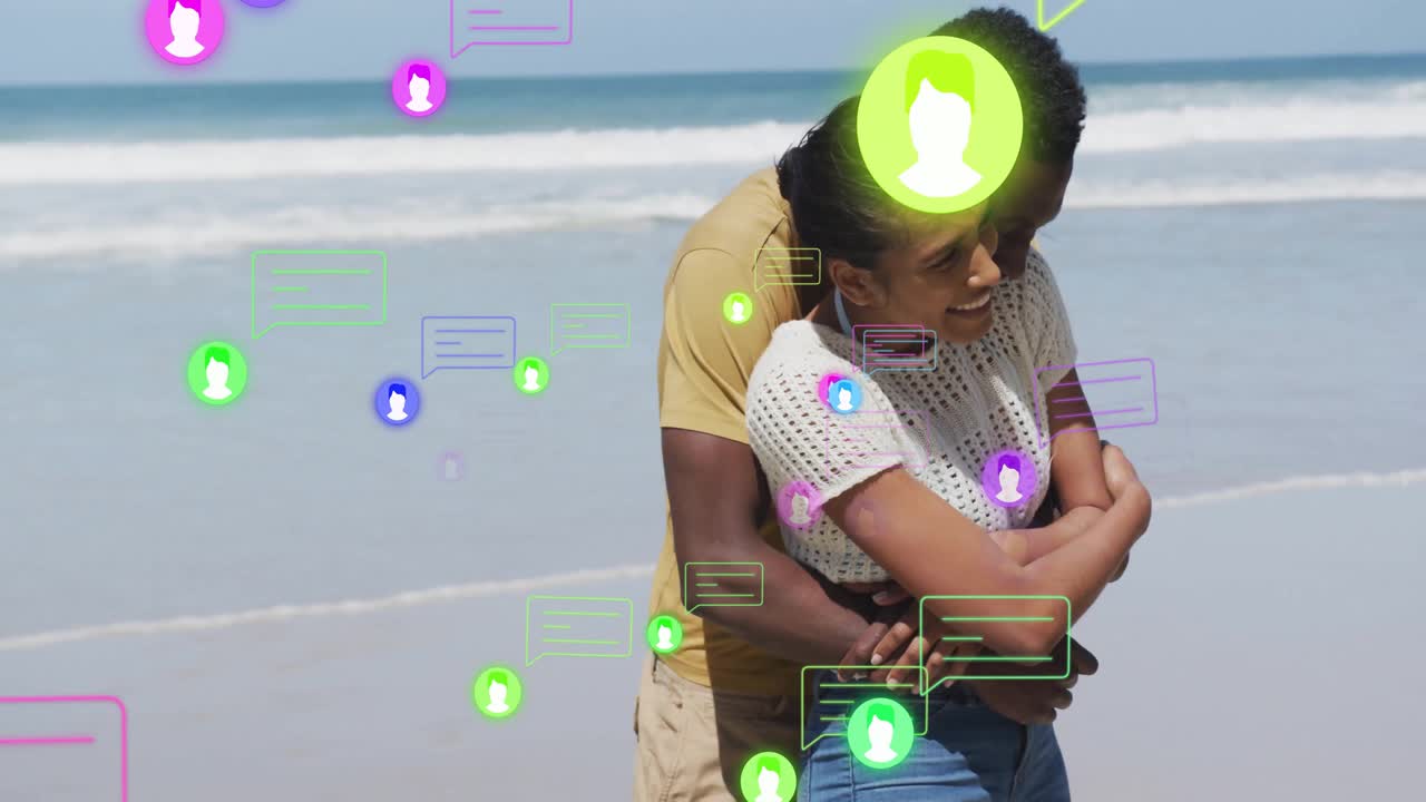 Couple hugging on sandy beach with chat icons drifting forward swirling around online connection
