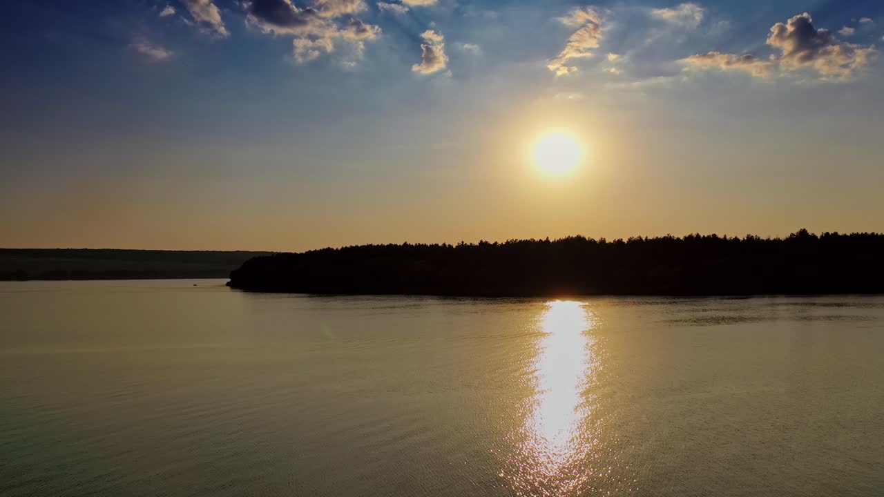 Natural dawn composition over lake. Scenic view of dramatic sky during sunset