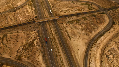 highways and speedways in the desert of nevada, usa. drone footage above the dry landscape at daytime. top view.