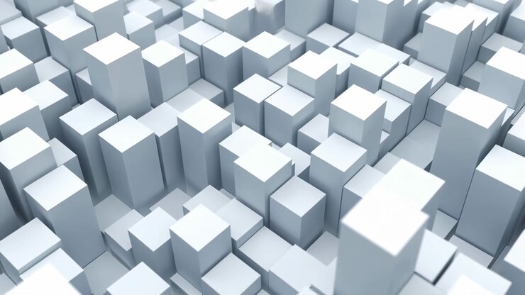 Rows of pale rectangular forms pass beneath an elevated angled view while taller and shorter blocks create changing depth, narrow channels, crisp edges, and soft gray shading.