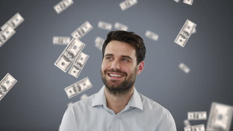 hombre de negocios con dinero en caída libre sobre fondo gris