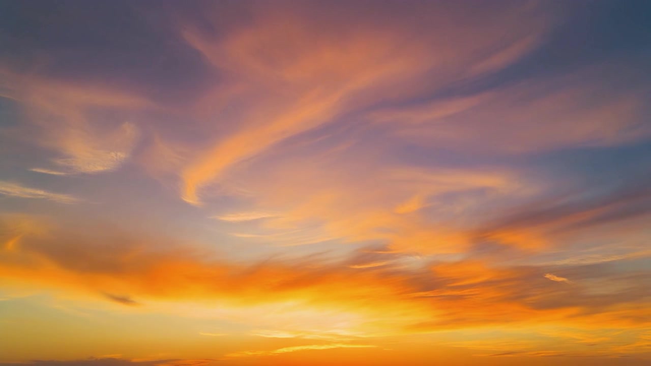 Vibrant Golden Hour Sunset Sky with Wispy Clouds