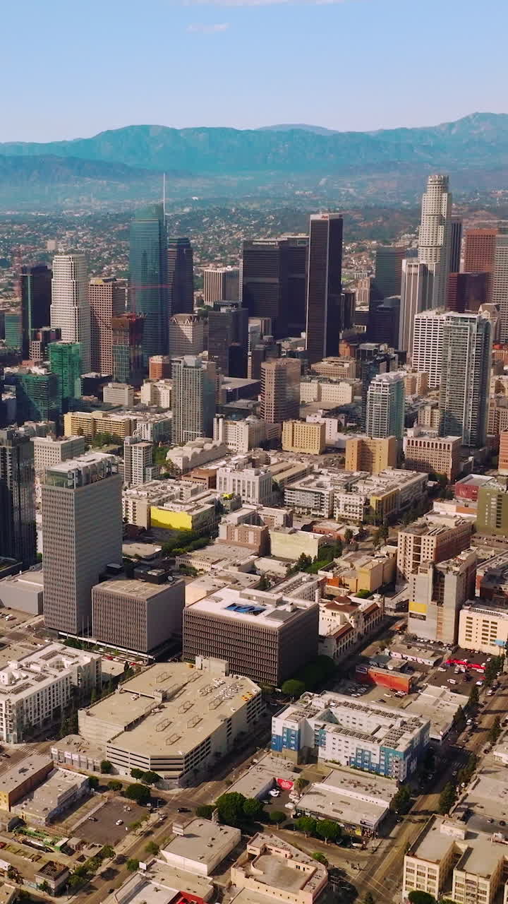 Los-Angeles aerial shot with skyscrapes. Sunny urban american city. Vertical video