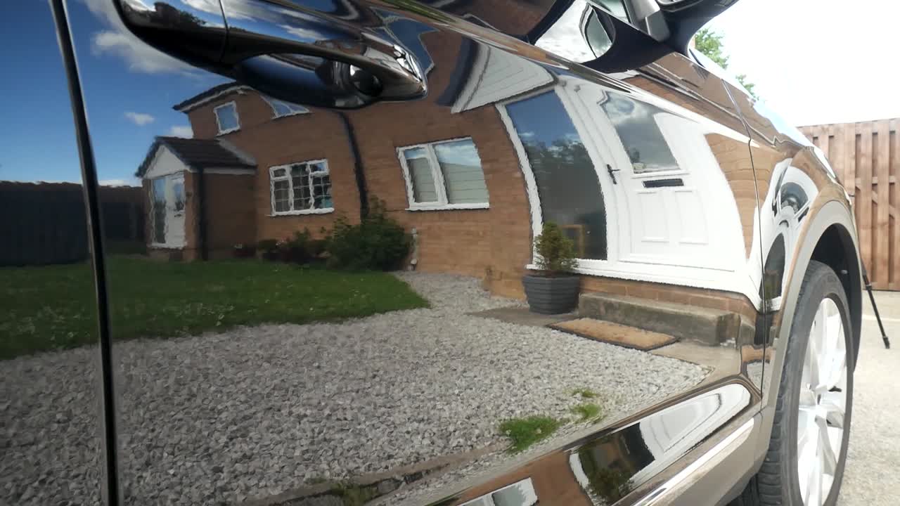 Shiny black car door hood