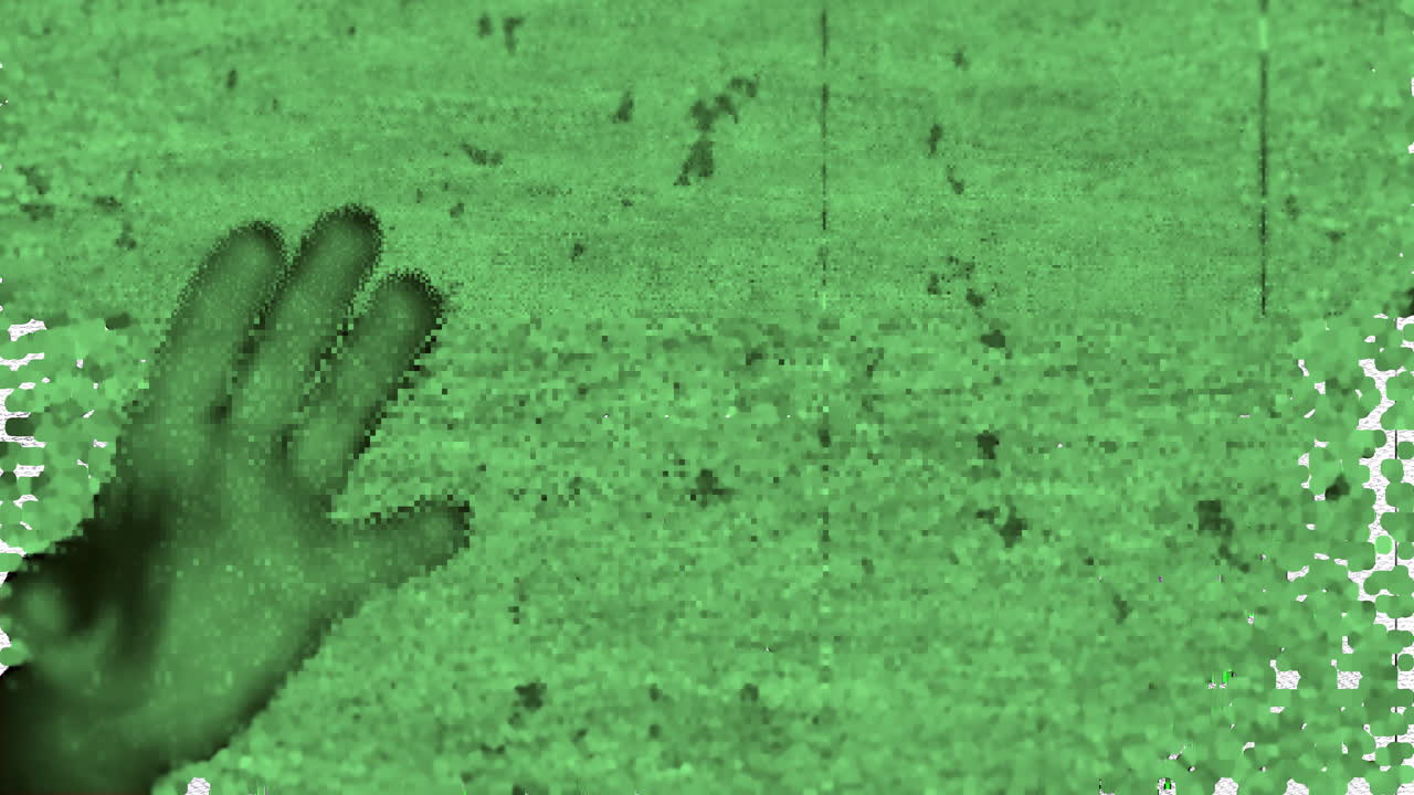 Animation of scary halloween pattern with screen noises over open hand