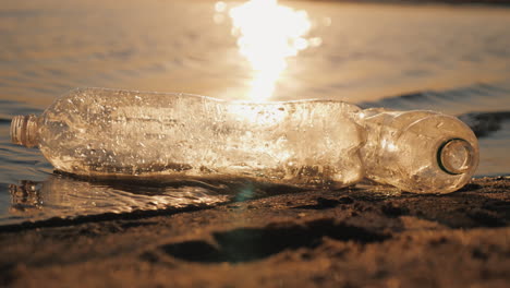 Two-Plastic-Bottles-Float-In-The-Water-Near-The-Shore-Plastic-Pollution-Concept