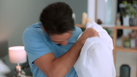 Pillow-fight,-happy-and-comic-couple-on-a-home