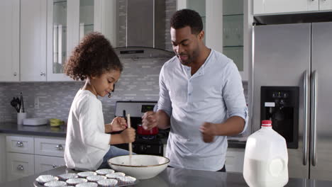 Black-dad-and-his-young-daughter-baking-together-at-home,-shot-on-R3D