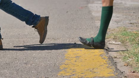 close up low angle of people walking across the street