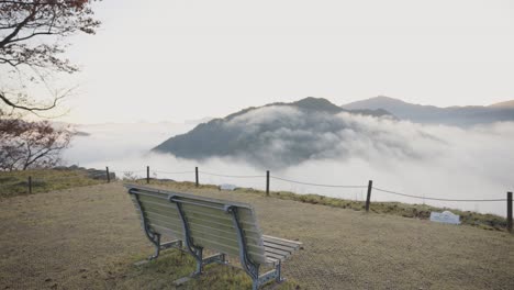 takeda castle ruins, bench chair looking over endless valley of mist, japan